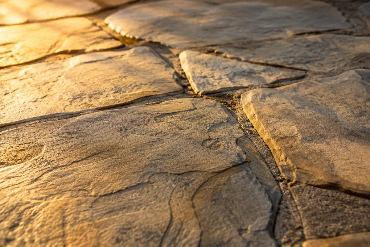 Close-up of flagstone patio joints in warm light